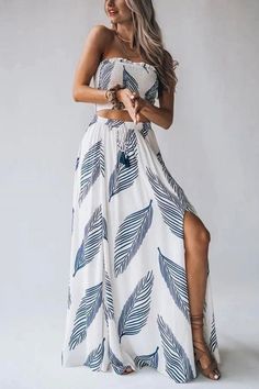 Step into laid-back luxury with our Casual and Fashionable Resort Style Long Dress. Effortlessly chic, this dress combines comfort and style for a perfect resort look. The flowing silhouette and breathable fabric make it ideal for leisurely strolls or seaside lounging. Elevate your vacation wardrobe with this versatile piece that effortlessly transitions from day to night. Halter Neck Tropical Print Dress For Beach Season, Tropical Print Beachwear Dresses For Resort Season, Beachwear Dresses With Tropical Print For Resort Season, Sleeveless Dress With Tropical Print For Beach Party, Sleeveless Tropical Print Dress For Beach Party, Tropical Print Halter Neck Dress For Vacation, Beachy Maxi Dress With Tropical Print, Resort Season Tropical Print Beach Dresses, Halter Neck Tropical Print Dress For Vacation