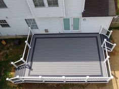 an overhead view of a deck with white railings