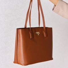 This Tote Exudes Elegance While Being Cruelty-Free. Its Spacious Interior Boasts Multiple Compartments And Pockets, Perfect For Organizing Your Essentials, From Laptops To Documents And Daily Necessities. Bag Size: Medium Material: Pu Imported Product Measurements: 13.3*5.1*11.4 In Gold Bags With Detachable Handle For Work, Gold Workwear Bag With Detachable Handle, Gold Double Handle Work Bags, Gold Double Handle Shoulder Bag For Work, Brown Satchel With Gold-tone Hardware For Work, Brown Workwear Satchel With Gold-tone Hardware, Gold Satchel Shoulder Bag For Work, Elegant Dark Tan Shoulder Bag With Leather Handles, Elegant Brown Satchel For Everyday Use