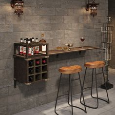 two bar stools sitting next to a counter with bottles on it