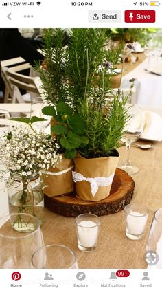 the table is set with flowers and glasses for guests to sit down at, or eat