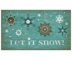 a wooden sign that says let it snow with snowflakes hanging from the side