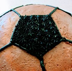 a close up view of a cake with black sprinkles on the top