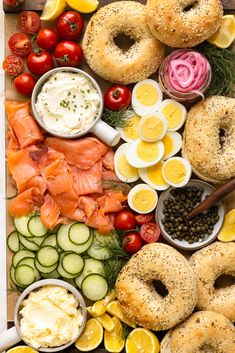 an assortment of food is laid out on a cutting board and ready to be eaten