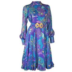 A fabulous 1970s La Mendola silk jersey and chiffon abstract peacock print cocktail dress with sheer balloon sleeves and button cuffs. Matching original belt with gold-tone buckle included. Peacock Cocktail Dress, Peacock Blue Dress, Peacock Feather Dress, Peacock Print Dress, Purple Chiffon Dress, Sheer Chiffon Dress, Blue Sheer Dress, Abstract Peacock, Blue Chiffon Dresses