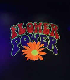 the flower power logo is painted on a black background with an orange and green flower