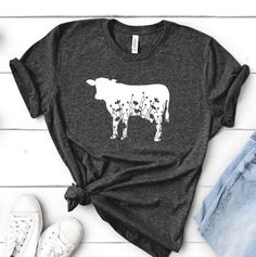 Floral Cow shirt, available in multiple colors on some of the softest shirts on earth! This is a unisex. If you see a color in the color chart that is not available please message me. *This item is made to order.  *Shirt is Bella + Canvas 3001 ~ 4.2 oz., 100% airlume combed and ringspun cotton.  ** Care Instructions** Turn shirt inside out Machine wash cold No bleach or fabric softener Do not dry clean Do not iron  Hang to dry - tumble dry low if needed Cow T Shirt, Farm Tees, Farmer Shirt, Dairy Farm, Cow Shirt, Cowgirl Shirts, White Cow, Girl Shirt, Farm Girl