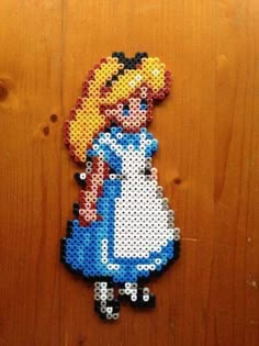 an image of a pixel art piece made out of perler beads on a wooden surface