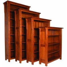 three wooden bookshelves sitting side by side in front of each other on a white background