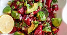 a white plate topped with beets, avocado and cilantro