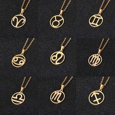 nine gold zodiac necklaces are shown on a black surface, each with an astro sign in the middle