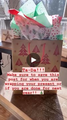 a gift bag sitting on top of a wooden table next to a window with the words make sure to save this post for when you are wrapping your present or if you are done