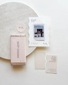 a table with some items on it including a photo and other things to include in the package