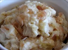 a white bowl filled with mashed potatoes and vegetables