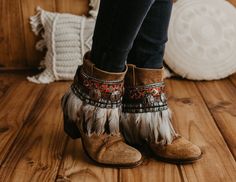 This bohemian ankle strap is the perfect accessory to decorate your high boots or ankle boots, they are made with carefully selected ethnic materials, in a completely handmade process, with them you will make those boots that you wear everywhere, and have super comfortable ones, have a different air when you want and so you can enhance that Boho-Chic style that we love so much. When purchasing a product, the complete pair (left foot and right foot) is included. This listing is for one pair of boot covers, footwear is not included. If you need a custom design or for a girl, do not hesitate to write to me and we will design it together Boot covers are adjustable to fit a variety of widths. Made with feathers, sequin embellishments and leather strap with metal conchos Handmade Adjustable leat Festival Boots With Tassels And Round Toe, Bohemian Boots With Tassels And Round Toe, Brown Tasseled Boots For Festivals, Bohemian Brown Boots With Tassels, Brown Bohemian Boots With Tassels, Bohemian Boots With Round Toe For Festivals, Bohemian Ankle Boots For Festivals, Bohemian Ankle-high Boots For Fall, Bohemian Round Toe Boots For Festival