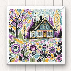 a cross stitch pattern with a house surrounded by trees and flowers on a wooden background