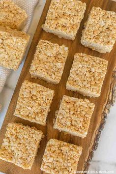 homemade granola bars on a wooden cutting board