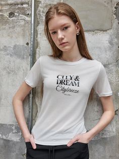 This is a short-sleeved t-shirt made from soft-touch Ultensel material. The graphic print on the front is not plain and creates a casual mood. - Neat silhouette with round neck- Looks slim with a feminine silhouette- Brand logo attached to the bottom Feminine Silhouette, Graphic Prints, Brand Logo, Round Neck, T Shirt