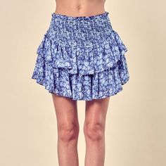 Introducing our Dizzy Floral Printed Tiered Skorts, a lively and fashionable addition to your wardrobe. These skorts offer a perfect blend of comfort and style, combining the practicality of shorts with the playful look of a skirt. The dizzy floral print adds a vibrant and dynamic touch to your outfit, while the tiered design provides movement and depth. Material & Care: Fabric Contents: Self: 100% Polyester/ Lining: 100% Rayon Care Instructions: Machine wash cold, gentle cycle, tumble dry low. Casual Tiered Skirt Bottoms With Floral Print, Casual Floral Print Tiered Skirt Bottoms, Floral Print Non-stretch Mini Skirt, Blue Tiered Skirt For Vacation, Blue Tiered Skirt For Day Out, Blue Mini Skirt Bottoms For Summer, Blue Mini Bottoms With Elastic Waistband, Blue Mini Length Bottoms For Summer, Blue Mini Length Bottoms With Elastic Waistband