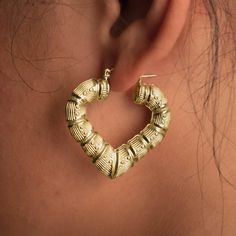 There is nothing more stylish than a pair of 10k Yellow Gold Heart Shaped Bamboo Hoop Earrings. They're a versatile look that can be paired with any kind of outfit and are suitable for any occasion. The click-snap earring closures support a full hoop shape that is crafted in resilient, eye-catching 10k Yellow Gold. Its gold composition is tougher than most gold types, allowing it to withstand years of daily wear. These hoops measure 1.67 inches from side to side and 1.37 inches from top to botto Trendy Small Hoop Heart Earrings, Trendy Small Hoop Earrings For Valentine's Day, Trendy Small Hoop Jewelry For Valentine's Day, Trendy Hoop Jewelry For Valentine's Day, Trendy Valentine's Day Hoop Jewelry, Pierced Hoop Earrings For Valentine's Day, Trendy Hoop Earrings For Valentine's Day, Heart Hoop Earrings Pierced, Heart Shaped Hoop Earrings With Ear Wire