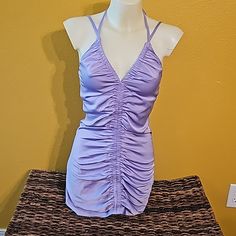 Size Sm, Satin Feel, Never Worn Lavender V-neck Mini Dress For Party, Fitted Lavender Mini Dress For Date Night, Flirty Lavender Mini Dress, Purple Stretch Flirty Mini Dress, Flirty Stretch Purple Mini Dress, Fitted Lavender Mini Dress For Evening, Lavender Flirty Dress For Date Night, Lavender Summer Party Dress, Lavender Ruched Dress For Party