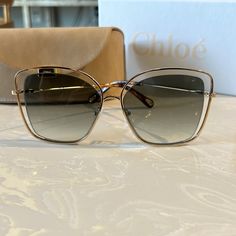 Metal Frame With Black Semi Transparent Lenses Chloe Glasses Eyewear, Chloe Sunglasses, Semi Transparent, Colored Sunglasses, Glasses Accessories, Gold Black, Metal Frame, Chloe, Square Sunglass