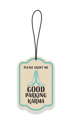 a luggage tag with the words good parking karma written on it and a blue ribbon hanging from