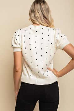 An easy to mix and match casual and cute embroidered polka dot knit top with a relaxed fit and short puffy sleeve. Relaxed Fit Crew Neckline Short Puffy Sleeve Knit Fabrication Ribbed Edges Polka Dot Embroidery Unlined 100% Cotton Hand Wash Cold, Lay Flat to Dry Imported Small: Length 22" Medium: Length 23" Large: Length 24" Casual Puff Sleeve Top With Pointelle Knit, White Short Sleeve Puff Top For Fall, Pointelle Knit Puff Sleeve Top, Casual Textured Knit Top With Puff Sleeves, Casual Textured Knit Puff Sleeve Tops, Polka Dot Cotton Top For Fall, Trendy Textured Knit Top With Puff Sleeves, Casual Polka Dot Puff Sleeve Tops, Polka Dot Embroidery