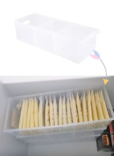 an open refrigerator door with toothpicks in the bottom drawer and on the inside