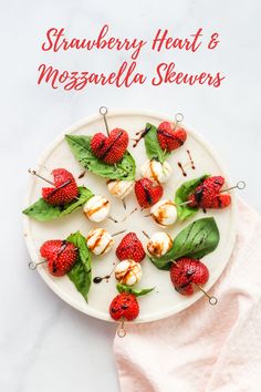 strawberries and mozzarella skewers on a white plate