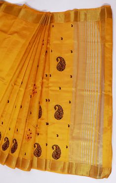 This Saree is Ready to Wear (With Fall and Pico Done). A designer saree in Yellow Color. It has intricate design all over the saree. This saree is a suitable amalgamation of style and grace that is required from an ethnic wear. The saree is ideal for any formal gathering. The saree comes with an unstitched blouse of corresponding color and design as shown in the picture. Silk Designer Yellow Color Saree Fabric Type: SilkPrimary Colour: YellowSecondary Colour(s): GoldenSaree Length: 6.0 meters including 0.8 meter blouseBlouse Material: Matching Silk (Same as picture)Washing Instructions: Dry Clean Only Festive Silk Pre-draped Saree With Motifs, Diwali Chanderi Pre-draped Saree With Motifs, Fitted Yellow Pre-draped Saree With Zari Weaving, Festive Tussar Silk Churidar With Traditional Drape, Tussar Silk Churidar With Zari Work, Festive Yellow Tussar Silk Pre-draped Saree, Unstitched Anarkali Pre-draped Saree With Self Design, Traditional Slub Silk Pre-draped Saree For Celebration, Yellow Slub Silk Pre-draped Saree With Cutdana