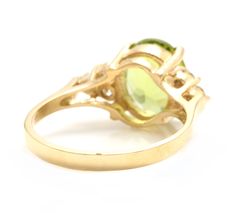 3.25 Carats Impressive Natural Peridot and Diamond 14K Yellow Gold Ring Suggested Replacement Value: Approx. $2,500.00 Total Natural Peridot Weight is: Approx. 3.00 Carats Peridot Measures: Approx. 10.00 x 8.00mm Natural Round Diamonds Weight: Approx. 0.25 Carats (color G-H / Clarity SI1-SI2) Ring total weight: Approx. 3.5 grams Disclaimer: all weights, measurements and colors are approximate and may vary slightly from the listed dimensions or as seen in the image. All pictures are magnified to Etsy Gold Ring, Yellow Gold Ring, Quality Diamonds, Solid Yellow, Yellow Gold Rings, Estate Jewelry, Jewellery And Watches, Gold Ring, Round Diamonds