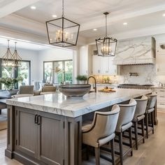 This picturesque food preparation zone includes a central island and integrated storage Kitchen With Square Island, Large Square Kitchen Island, Kitchen Lighting Fixtures Flush Mount, Big Kitchen Island, Kitchen With Big Island, Integrated Storage, Kitchen Lighting Ideas