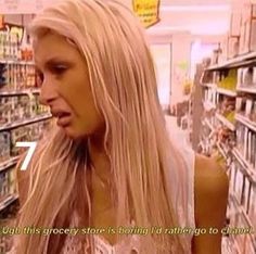 a woman with long blonde hair in a grocery store