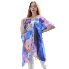 Blue and pink print kimono with the country of Greece printed throughout the garment. Great accent piece for any outfit. 34'' long from high point of shoulder to hem Fits sizes 2-16 100% cotton Hand wash cold water; dry flat Imported Blue Wrap Kimono For Summer, Long Multicolor Print Kimono For Spring, Blue Free Size Kimono For Spring, Summer Festival Blue Kimono, Blue Printed Festival Kimono, Blue Printed Kimono For Spring, Blue Printed Kimono For Festival, Blue Free Size Kimono With Kimono Sleeves, Summer Multicolor Print Kimono With Kimono Sleeves