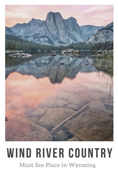 a lake with mountains in the background and text that reads wind river country must see place in wyoming