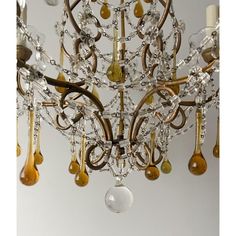 an antique chandelier with many bulbs hanging from it