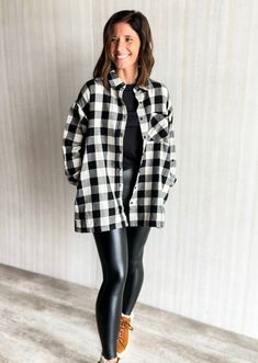 This oversized flannel shirt with pockets is perfect for chilly days. Crafted from a lightweight plaid fabric, it features a comfortable fit and the classic black and white buffalo check. Shown paired with our Black Faux Leather Leggings, but also an easy piece to style with jeans for a classic look. Also comes in red/black. Material: 100% Cotton Black White Check Shirt Outfit, Black And White Plaid Shirt Outfit, White Plaid Shirt Outfit, Flannel Jacket Outfit, Black And White Flannel Outfit, Black White Red Outfit, White Flannel Outfit, Checked Shirt Outfit, Oversized Flannel Shirt