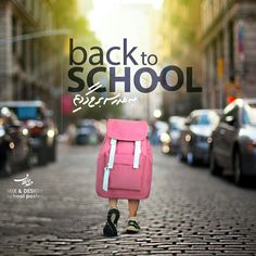 a person with a pink backpack is walking down the street