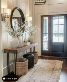 a foyer with two vases and baskets on the floor