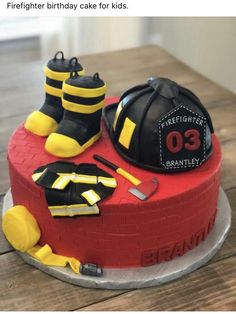 a birthday cake with fireman's gear on top