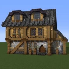 a very nice looking house made out of wood and stone, with lots of windows