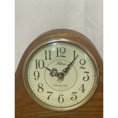 an old fashioned clock with numbers on the face