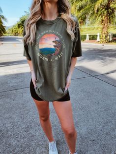 "Get ready to be OBSESSED with your new oversized hiking views shirt. It's the cutest and most trendy way to emit all those important granola girl vibes! This is the perfect camping lover tshirt! Great as a hiking lover gift! 🌈SHOP SIMILAR ITEMS↓ etsy.com/shop/BrightDogInspiration | https://www.etsy.com/shop/BrightDogInspiration?ref=seller-platform-mcnav * Q U I C K * F A C T S * ✺ 100% ring-spun cotton ✺ Relaxed fit ✺ Medium fabric (6.1 oz/yd² (206.8 g/m ✺ Sewn-in twill label ✺ Wash and dry normally (on cool heat or line dry for best results) * DETAILS* ✺ DTG Printing is used for our shirts, sweatshirts, and hoodies ✺ We stress that you check the sizing chart before purchasing ✺ DTG PRINTING:: Designs are printed directly on the garment using DTG (direct to garment) to ensure a long-last Oversized Letter Print Tops For Outdoor, Casual Relaxed Fit T-shirt For Outdoor Activities, Casual Short Sleeve T-shirt For Adventure, Trendy Outdoor Relaxed Fit T-shirt, Trendy Relaxed Fit T-shirt For Outdoor, Casual T-shirt For Outdoor Spring Activities, Casual T-shirt For Outdoor Spring Events, Casual T-shirt For Spring Outdoor Activities, Green Shirt For Summer Outdoor Activities