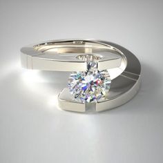 two wedding rings with a single diamond in the middle