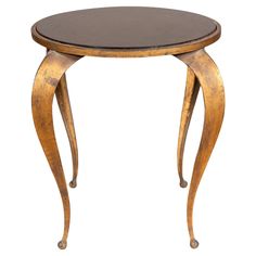 a small wooden table with curved legs and a black leather top on an isolated white background