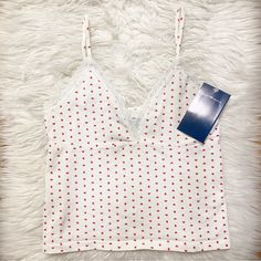 Brandy Melville Amara Heart Lace Tank Top Cotton Blend Crossover Lace V-Neck Tank Top With Red Hearts And Seam Under The Bust. Measurement: 18.5" (47 Cm) Length, 14" (36 Cm) Bust Brand New With Tags Same Day Shipping Cute V-neck Top With Heart Print, Heart Print V-neck Top For Spring, Spring V-neck Top With Heart Print, American Flag Tank Top, Black Lace Tank Top, Heart Tank Top, Lace Trim Tank Top, V Neck Tank Top, Lace Bows