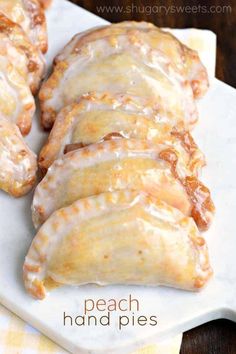 a close up of doughnuts on a plate with glaze and icing