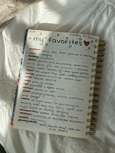 an open notebook with the words my favorites written on it