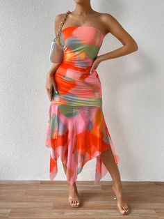 This Summer Vibes dress will elevate your summer wardrobe with its vibrant tie-dye print and flirtatious ruffled hem. The strapless design is perfect for sunny days, and the lightweight fabric ensures maximum comfort. Channel your inner fashionista with this trendy and versatile dress. Color : Multicolor Style : Boho Style : Sexy Pattern Type : Tie Dye Details : Ruched Sleeve Length : Sleeveless Details : Asymmetrical Neckline : Strapless Details : Split Thigh Type : Bodycon Waist Line : Natural Hem Shaped : Asymmetrical Hem Shaped : Mermaid Hem Shaped : Slit Length : Midi Fit Type : Regular Fit Fabric : Slight Stretch Material : Knitted Fabric Composition : 100% Polyester Care Instructions : Machine wash, do not dry clean,wash with the soft detergent Sheer : No Size US Bust Hip Size Lengt Summer Beach Strapless Dress With Ruffles, Summer Party Strapless Dress With Ruffle Hem, Strapless Summer Dress With Ruffle Hem, Ruched Strapless Sundress For Summer, Trendy Strapless Beach Dress, Summer Beach Strapless Dress With Ruffle Hem, Summer Flirty Orange Dress, Casual Strapless Dress With Ruffle Hem For Beach, Flirty Orange Summer Dress